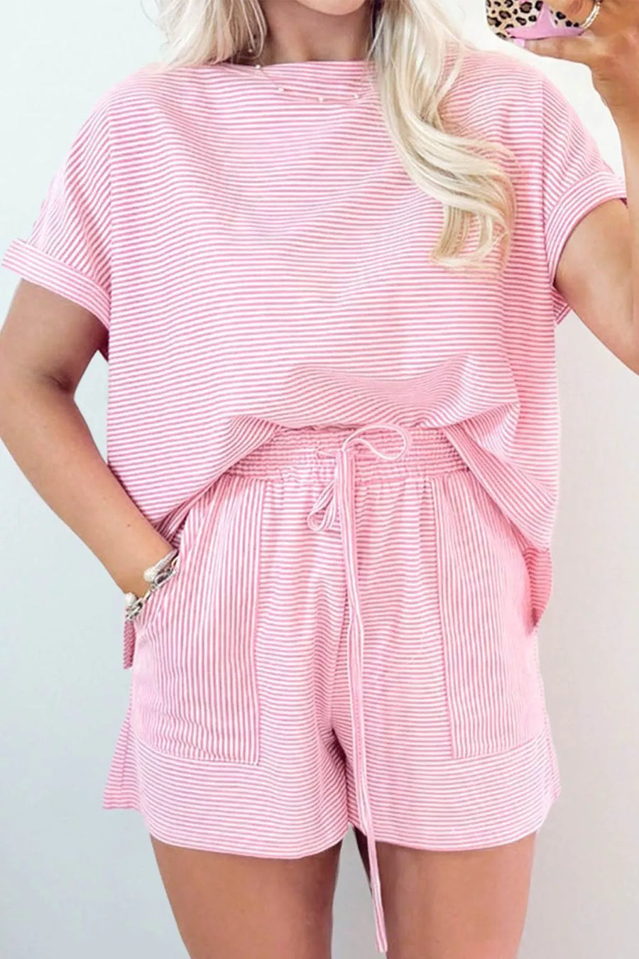 Pink striped cotton tee and shorts set with drawstring waist and cuffed sleeves.