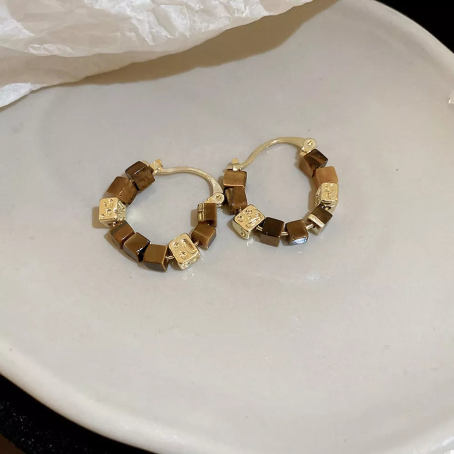 brown earrings featuring geometric beads and geometric