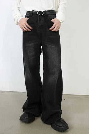 Oversized black wash denim jeans with a wide leg and casual styling.
