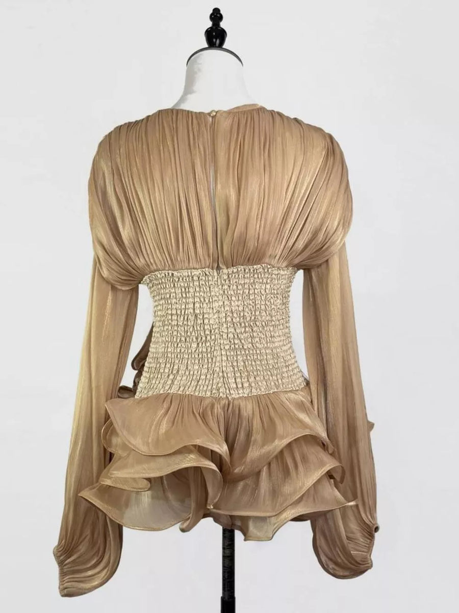 Gold ruffled mini dress with long sleeves, corset waist, and tiered skirt.