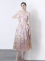 Strapless midi dress in purple pink with 3d floral appliques and a-line skirt.