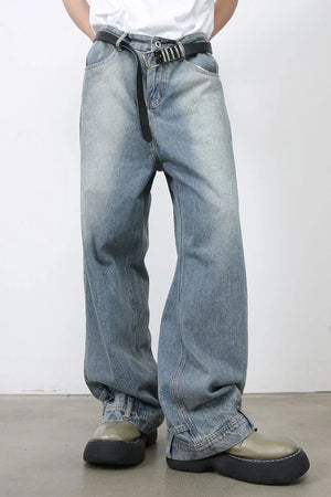 Baggy medium wash denim jeans with distressed detailing and a casual fit.