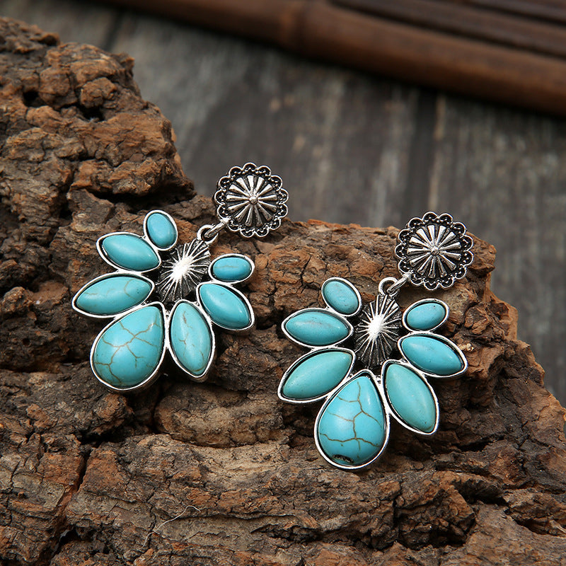 Turquoise floral petal drop earrings with alloy metal details.