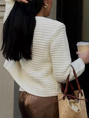 Textured white acrylic button-down cardigan with horizontal ribbing detail.