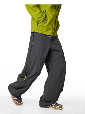 Graphite gray cargo active pants with drawstring and zippered pockets.