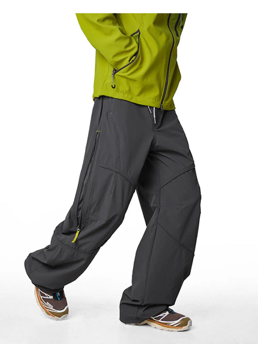 Graphite gray cargo active pants with drawstring and zippered pockets.
