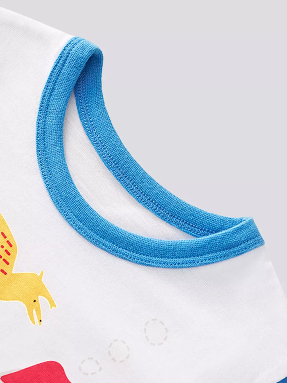 White cotton tank top with blue trim and a yellow dinosaur graphic.