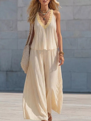 Yellow striped two-piece set with ruffle trim V-neck tank and wide-leg pants.