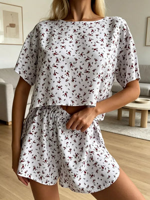 Relaxed floral lounge set with short sleeves and elastic waist shorts.