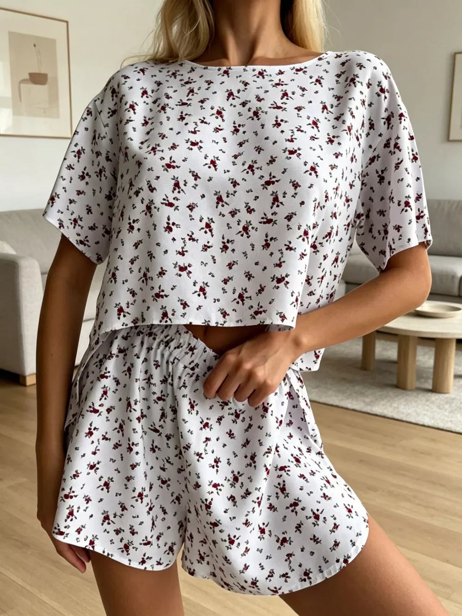 Relaxed floral lounge set with short sleeves and elastic waist shorts.