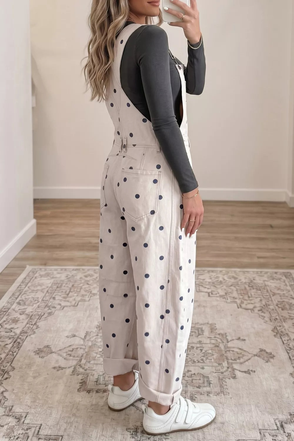 Denim overalls with navy polka dots, buttoned front, and cuffed legs.