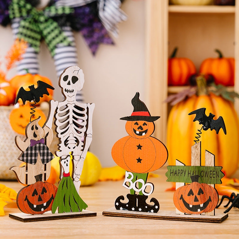 Spooky wooden Halloween scene set with skeleton, ghost, pumpkin figures, bats, and "Happy Halloween" sign.