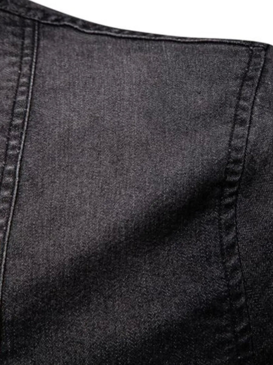 Dark wash denim shirt with visible stitching detail on shoulder and collar.