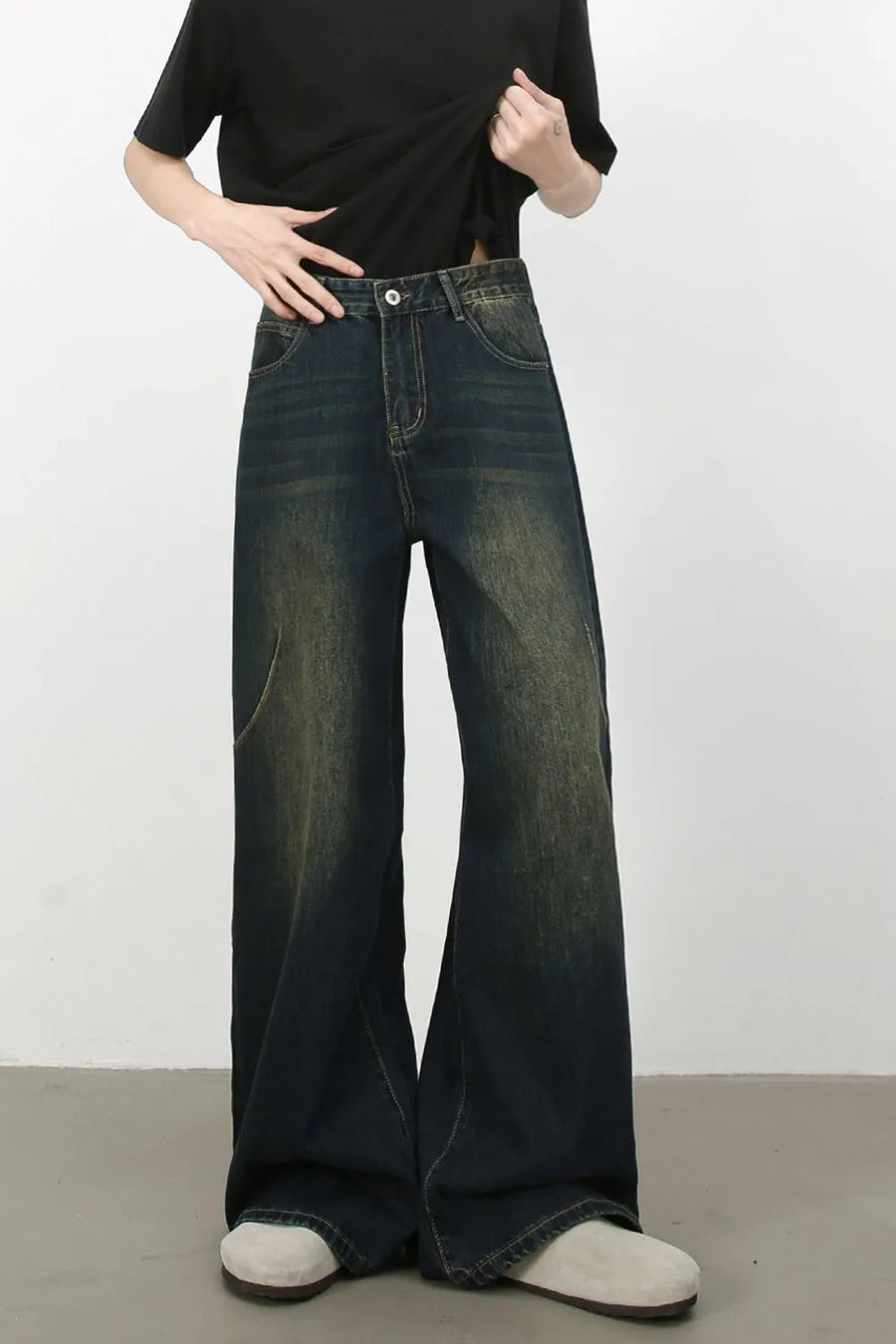 Dark wash palazzo jeans with faded details and wide leg