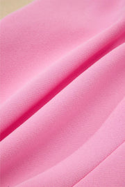 Pink cotton sweatshirt fabric with soft texture and draped folds.