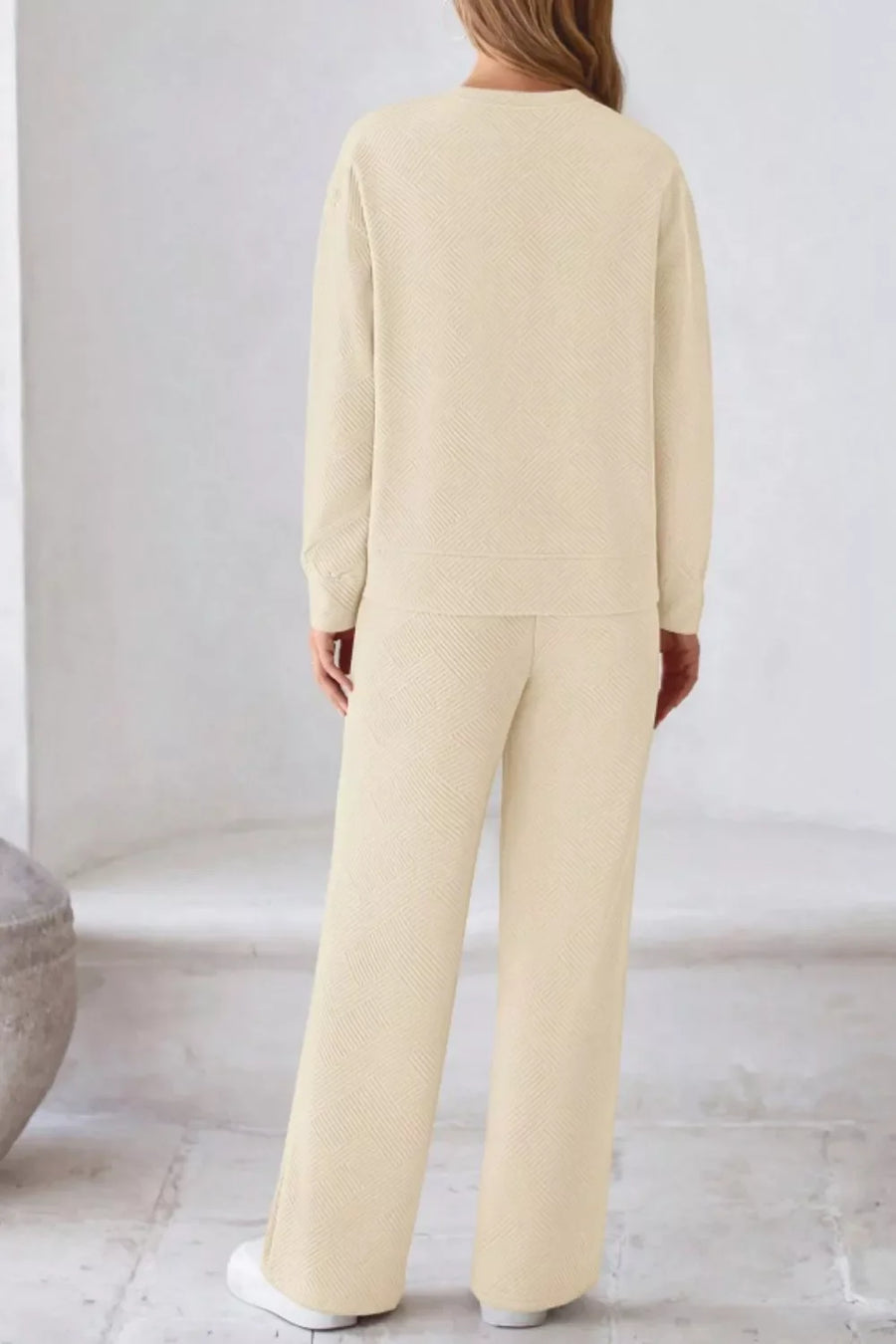 Cozy drawstring lounge set in apricot with textured pattern.