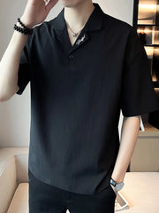 Black cotton polo shirt with embroidered collar detail and button-down neckline.