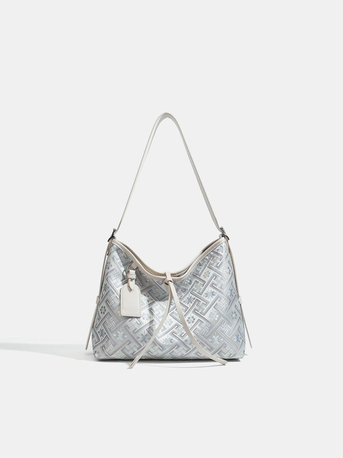 handbag in silver featuring adjustable strap and slouchy fit