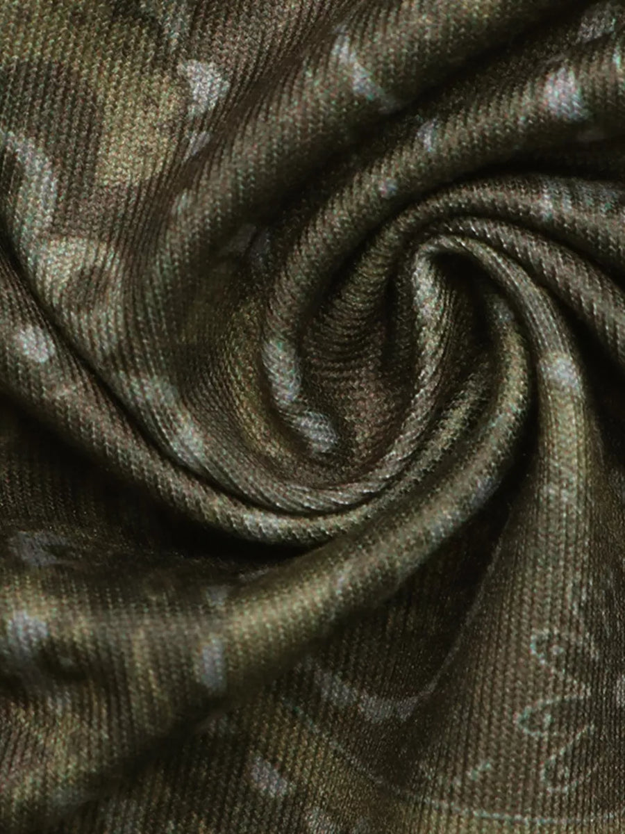 Vibrant paisley print bandeau top in a textured fabric with a swirling pattern.