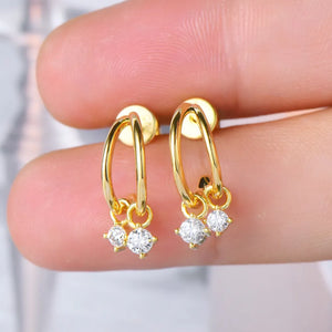 Gold cubic drop hoop earrings with clear cubic zirconia charms.