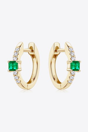 Gold huggie hoop earrings with emerald and pave diamond accents