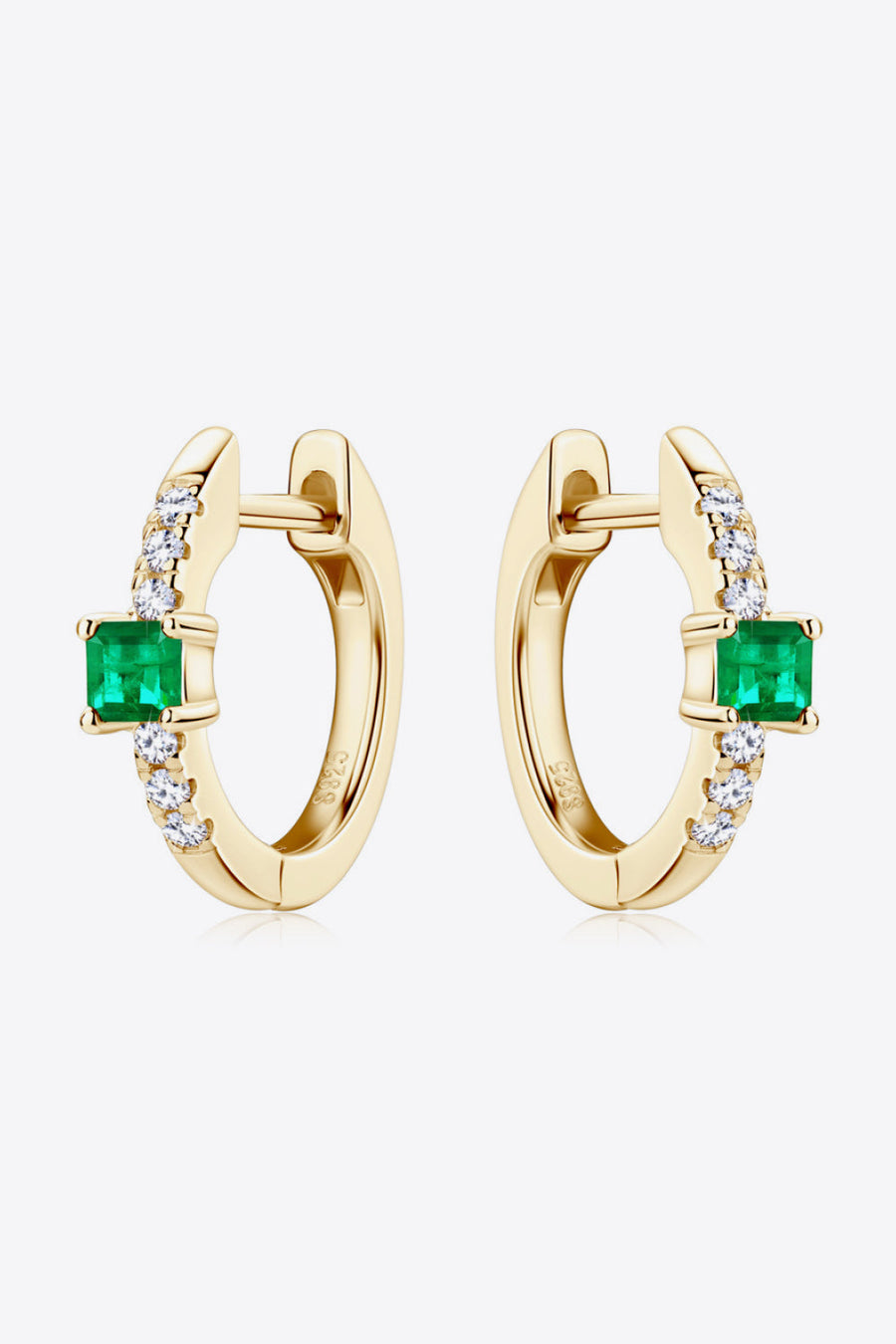 Gold huggie hoop earrings with emerald and pave diamond accents