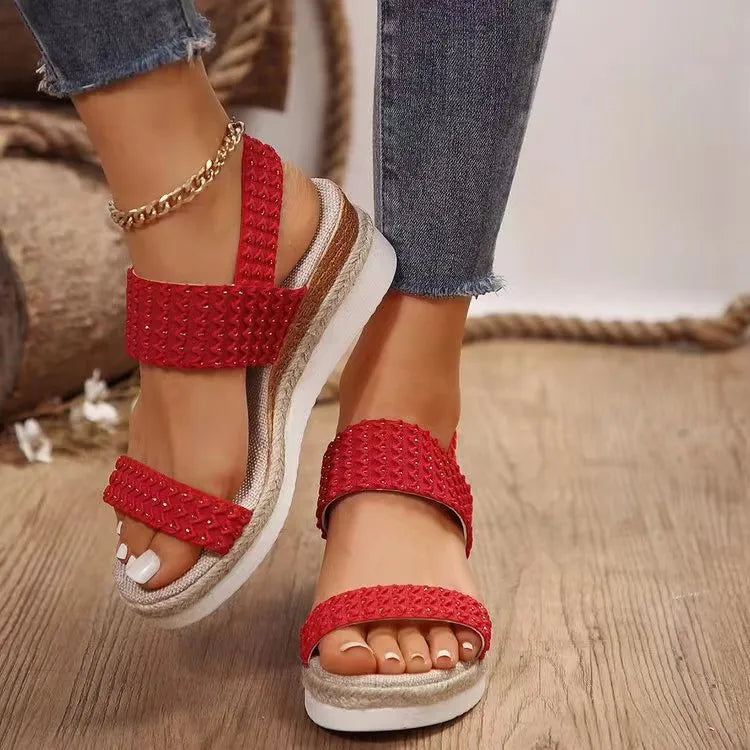 Red textured strap espadrille wedges with a platform sole.