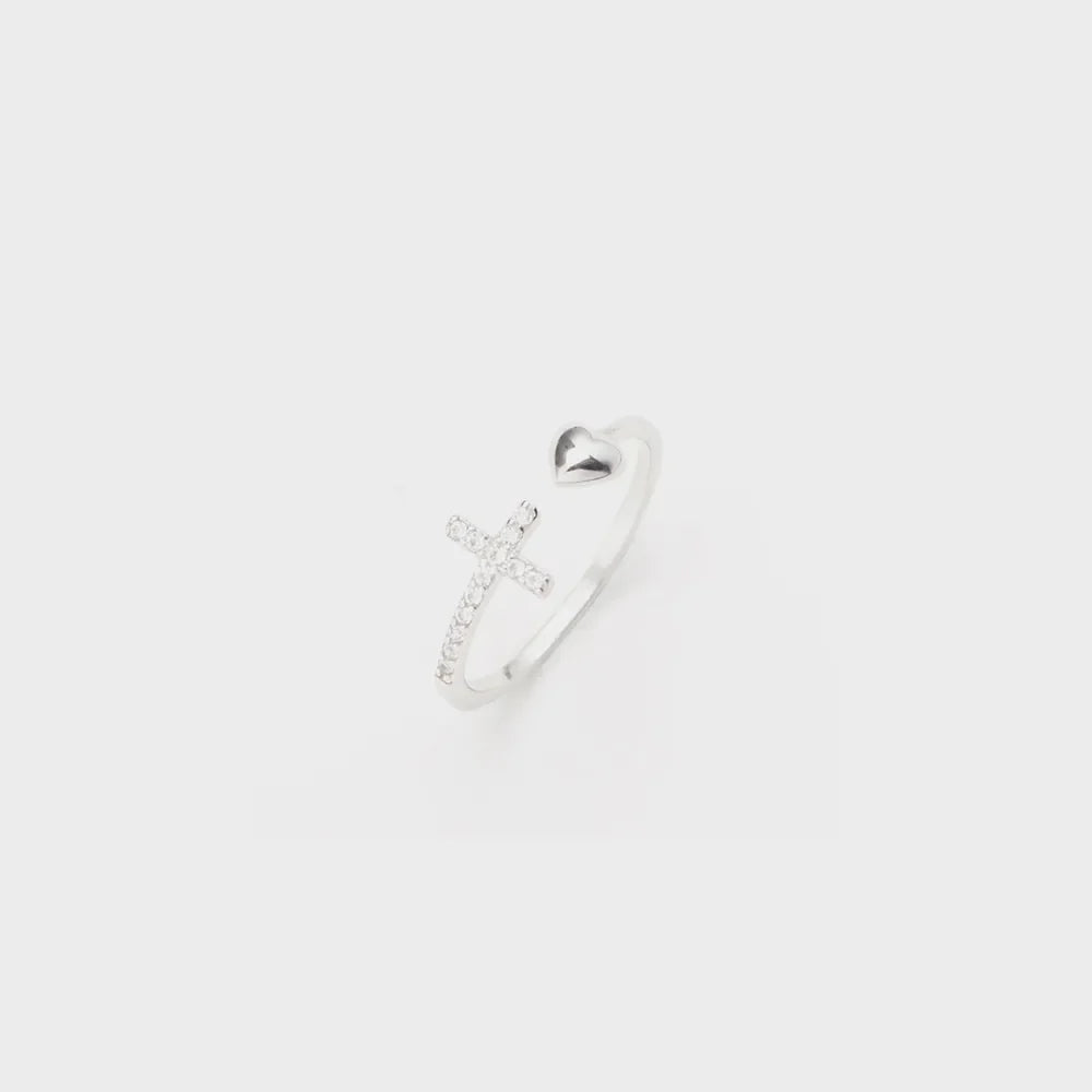 Silver ring with open heart and pave cross detail