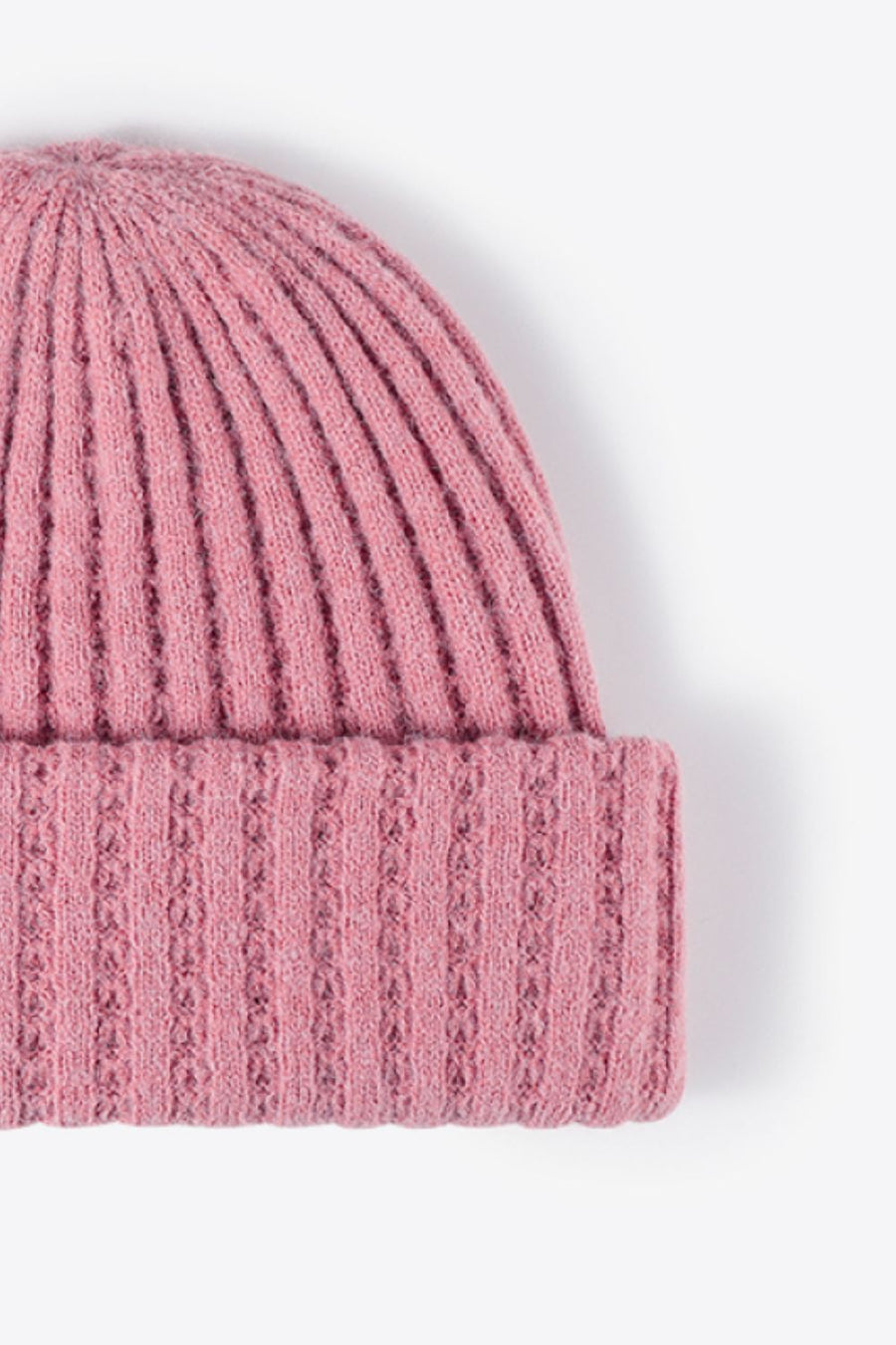 Pink acrylic ribbed knit beanie with textured cuff detail