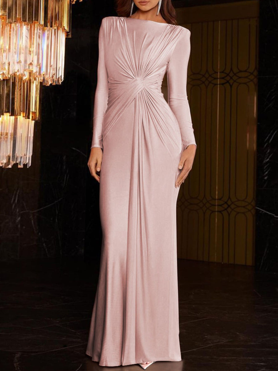 Pink ruched knot front maxi dress with long sleeves and a draped neckline.