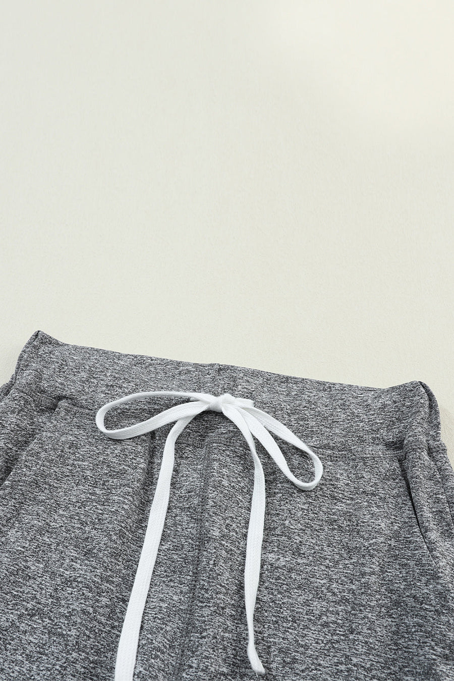 Slim-fit joggers in dark gray heather with white drawstring detail