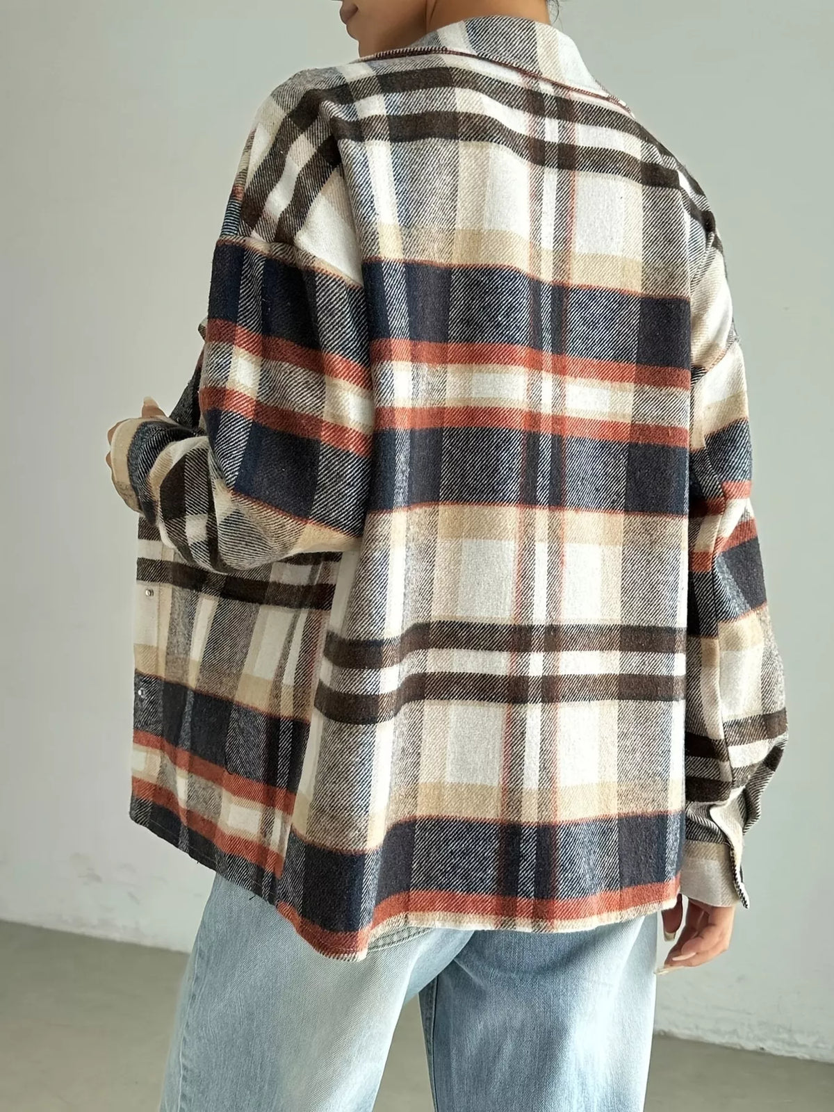 Relaxed fit plaid shirt jacket in mocha with button front and classic collar.