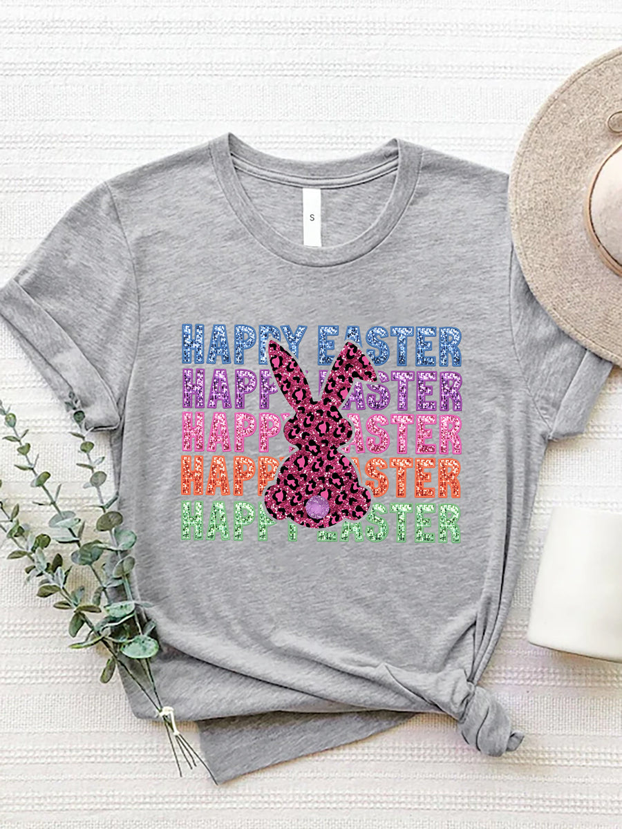 Gray t-shirt with leopard bunny graphic and glitter text reading Happy Easter in rainbow colors.