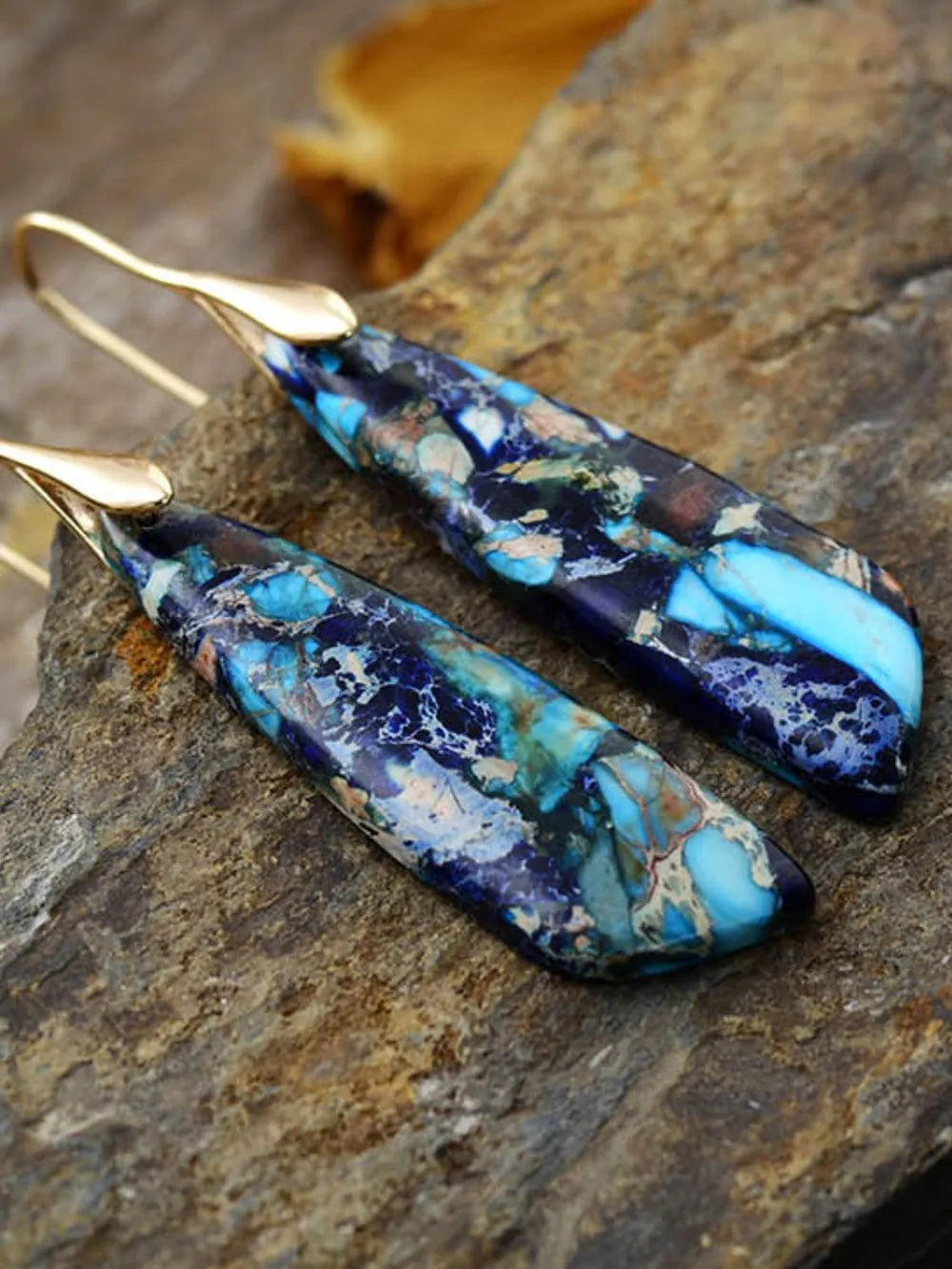 Azure Stone Teardrop Earrings with gold-plated hooks, featuring blue and gold marbled stone.