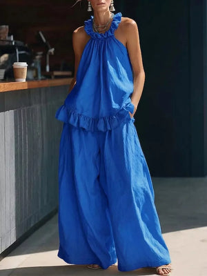 Blue ruffled halter neck top and wide-leg pants set with frill details.