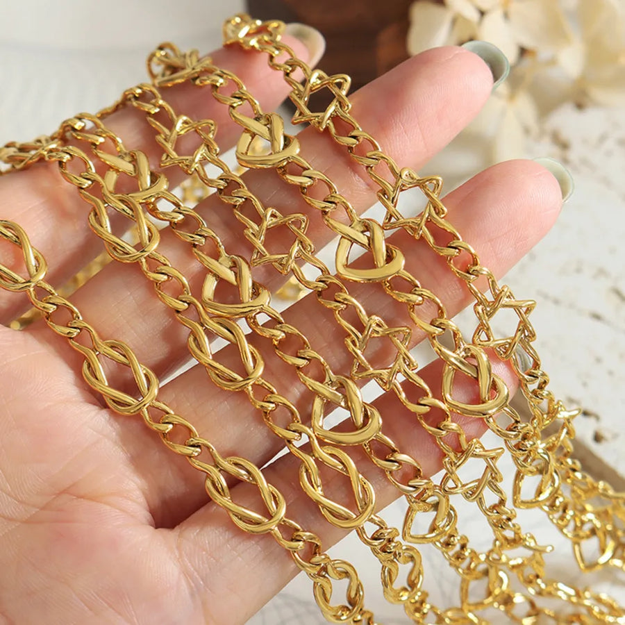 Gold heart link chain necklace with knot details, brass material.