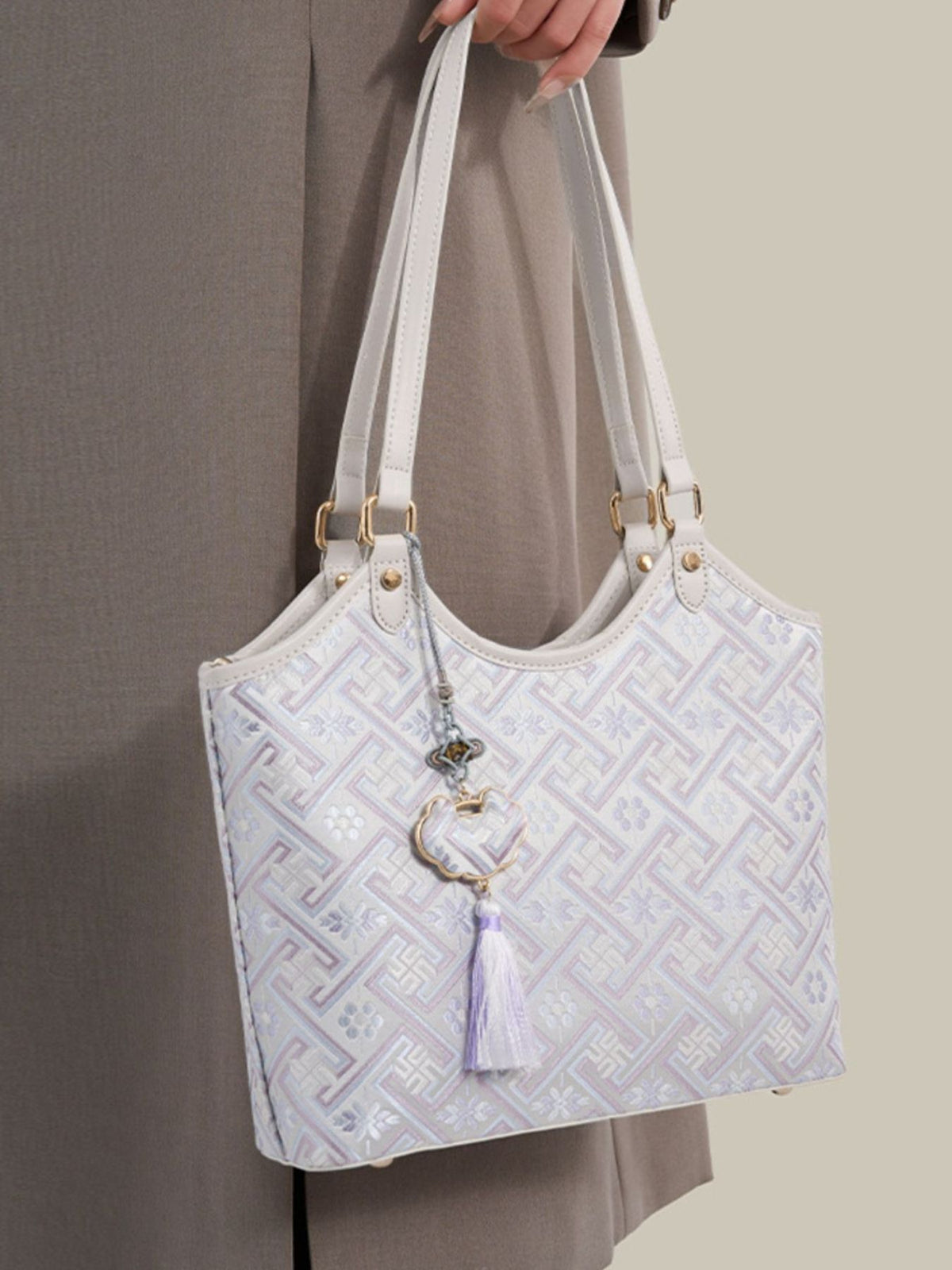 off-white shoulder bag featuring shoulder straps and geometric