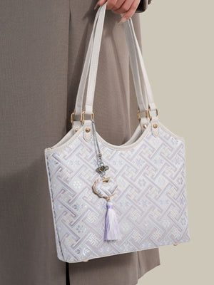off-white shoulder bag featuring shoulder straps and geometric
