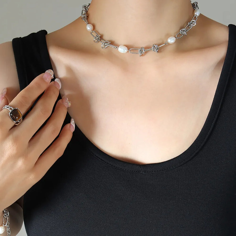 Silver linked pearl knot collar necklace with oval pearls and chain links