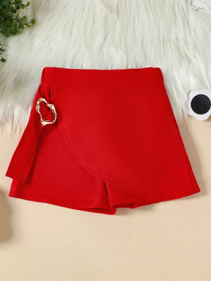 Red skort with wrap detail and gold heart buckle.