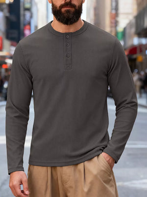 Men's gray long sleeve Henley t-shirt with button placket and crew neck.