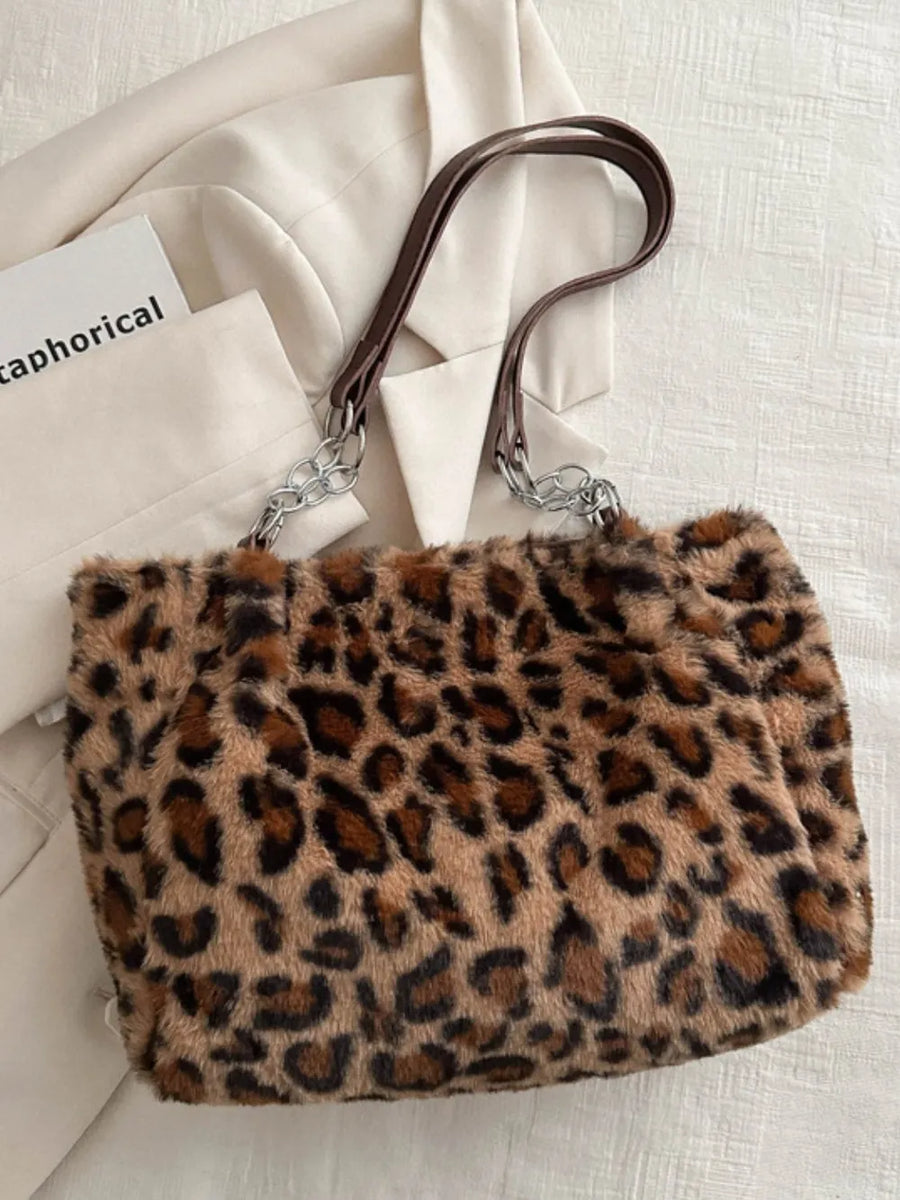 Leopard print faux fur tote bag with brown leatherette and chain handles.