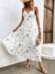 White floral print spaghetti strap midi dress with adjustable straps and v-neck.