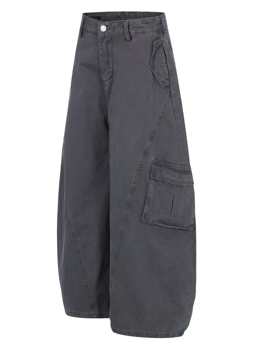 Grey wide-leg cargo pants with prominent pocket details and contemporary cut.