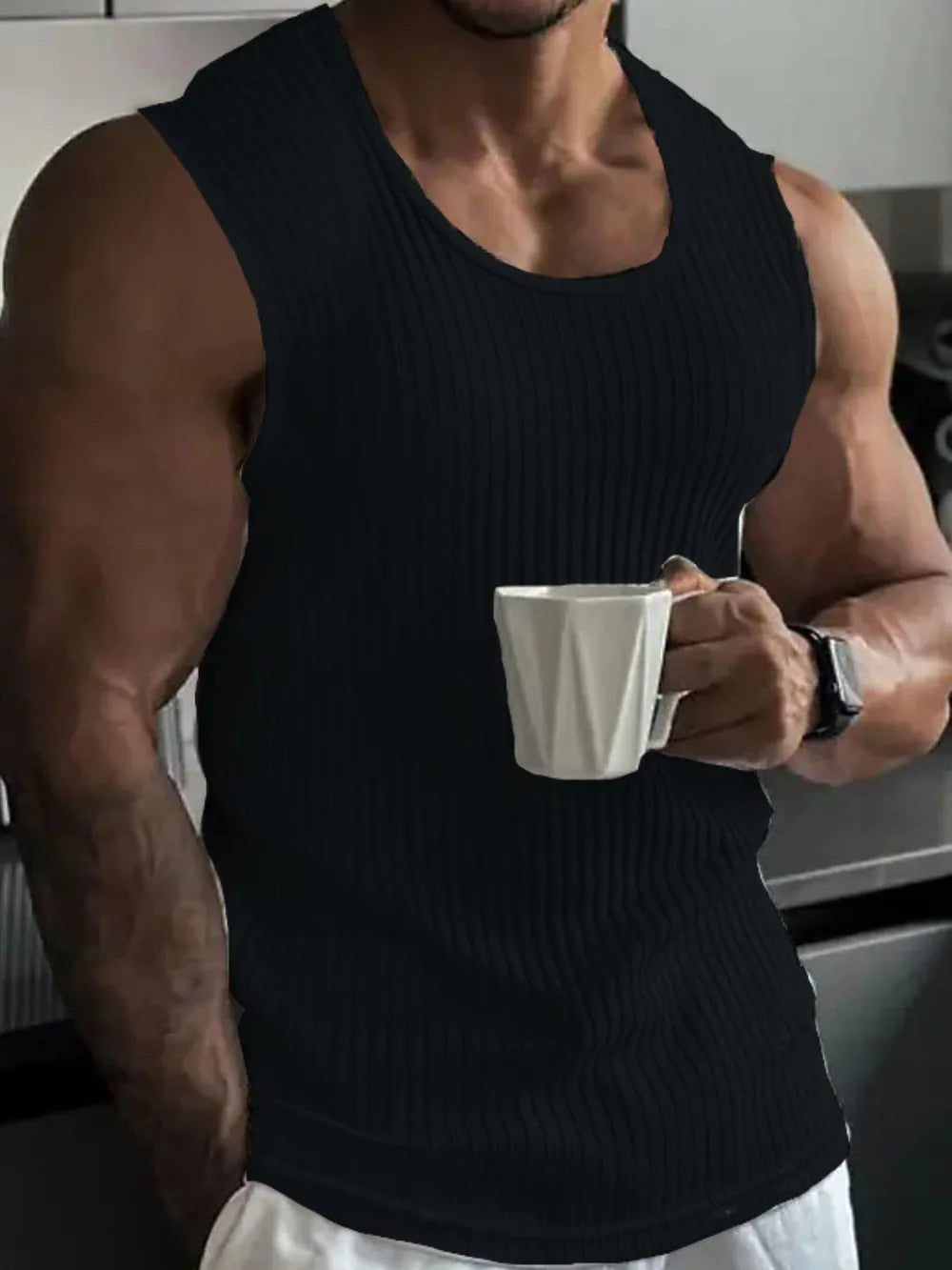 Black ribbed tank top with athletic fit and scoop neck.