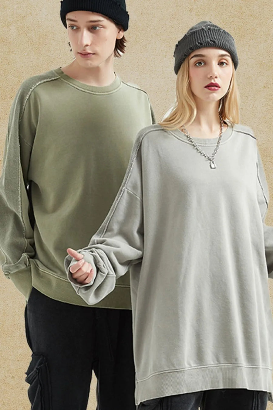 Oversized sweatshirt in gray with raw-edge seams and crew neckline.