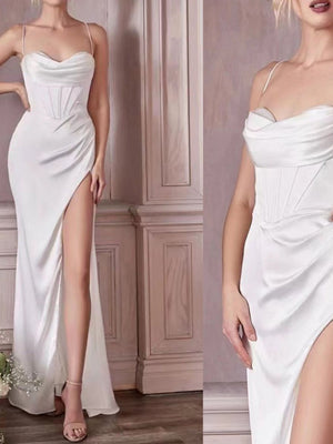 White satin maxi dress with cowl neck, corset bodice, and high slit.