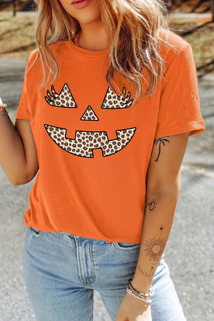 Orange t-shirt featuring rolled sleeve and graphic