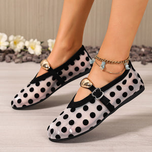 Black polka dot mesh slip-on flats with gold heart detail and ankle strap.