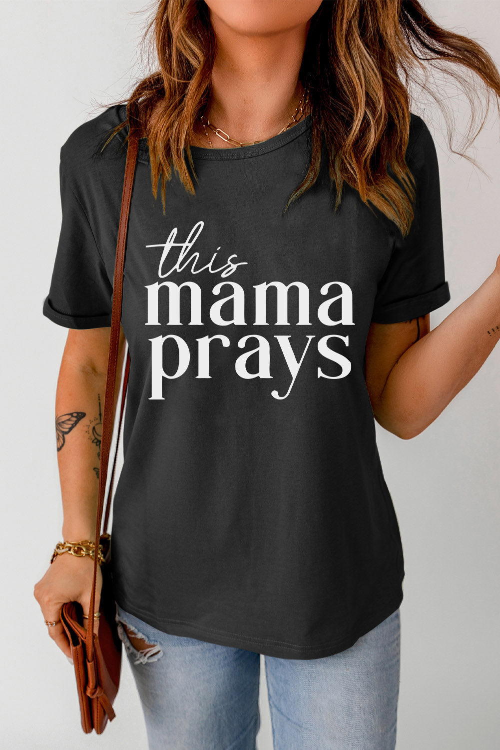 Black maternity t-shirt with white scripted text that says "this mama prays